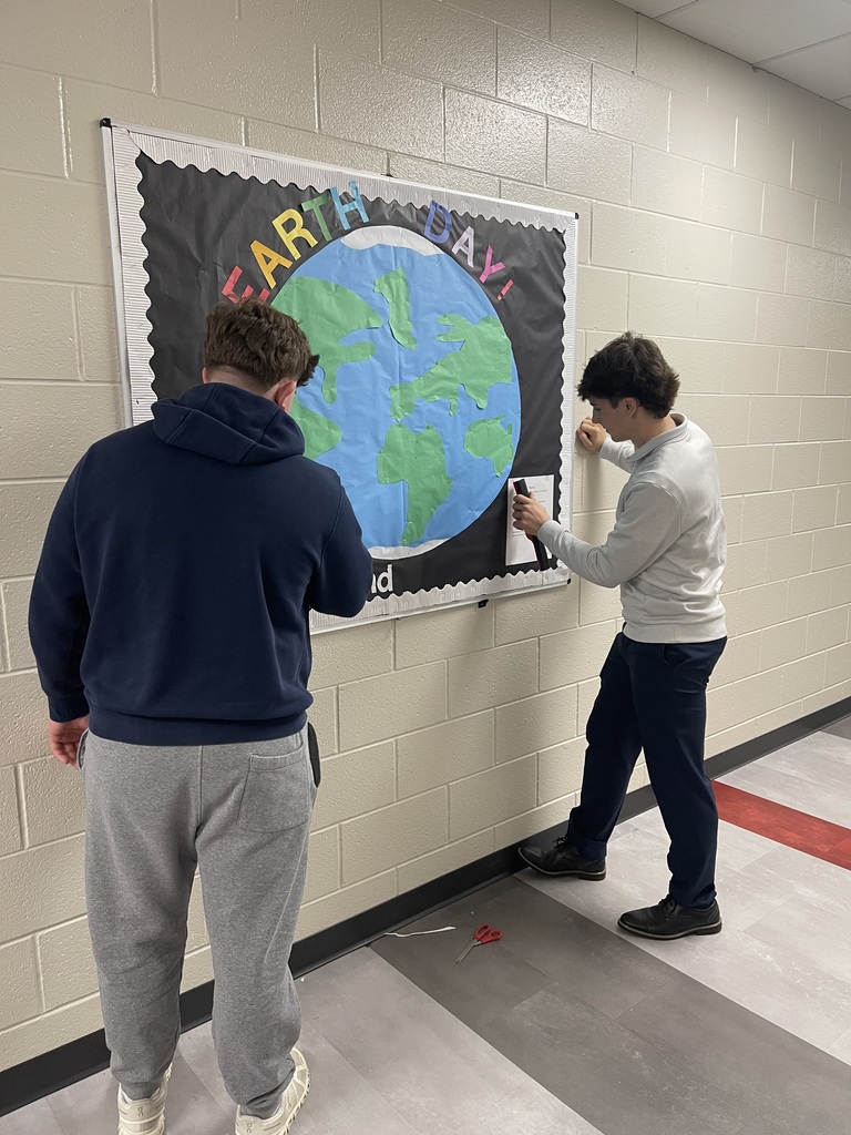 Students creating an Earth Day Bulletin Board