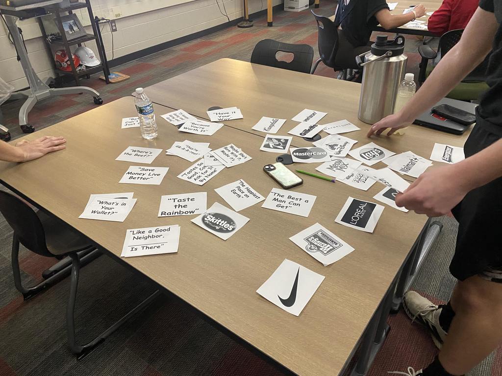Students in Mrs. Parkin's Entrepreneurship class compete to see who can correctly match the most logo0s and slogans in the least amount of time.