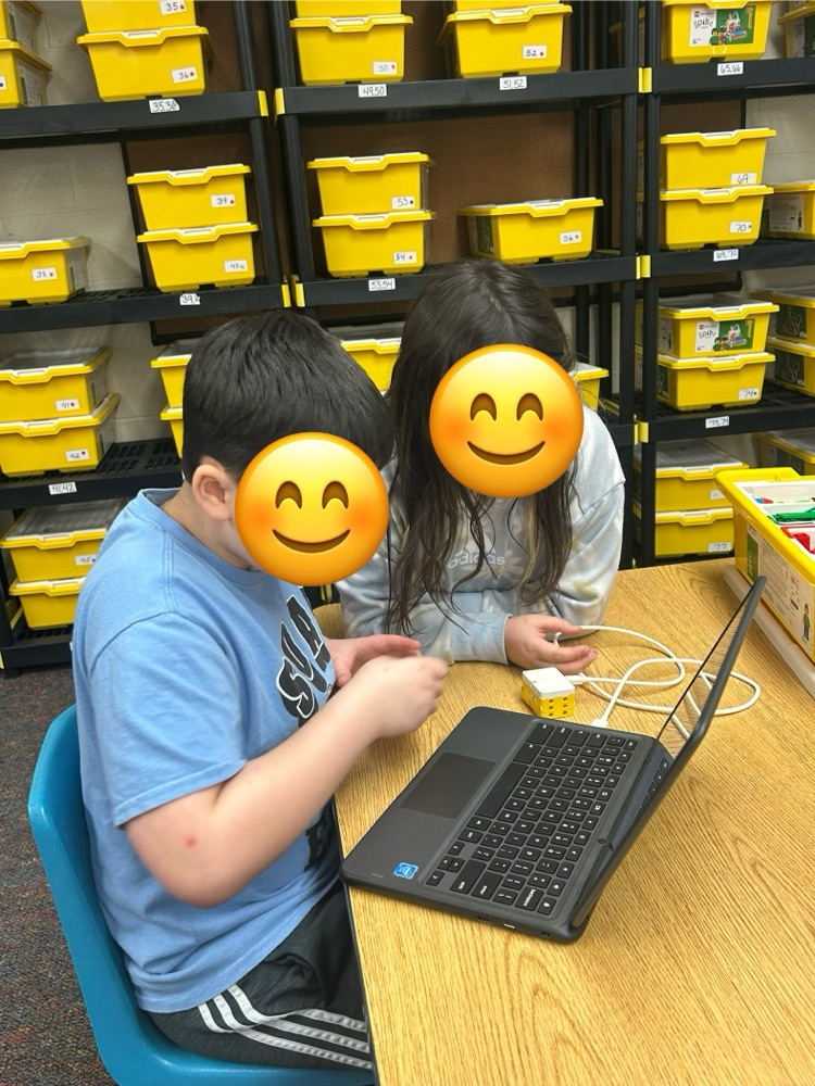 Students coding on a Chromebook 