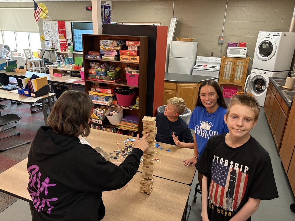 students building a jenga tower