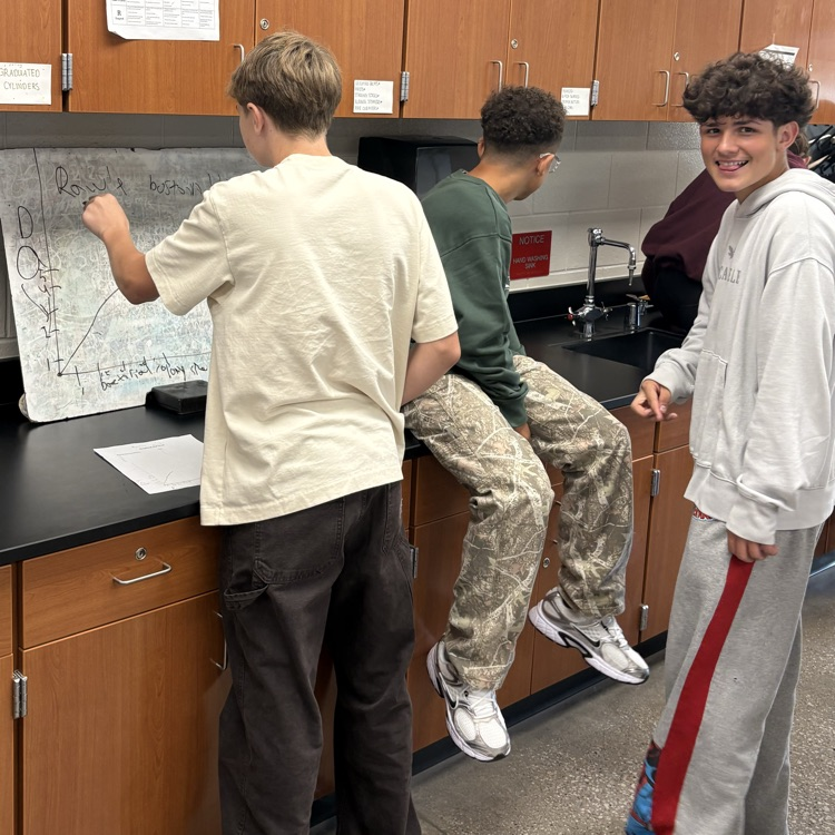 students graphing in science