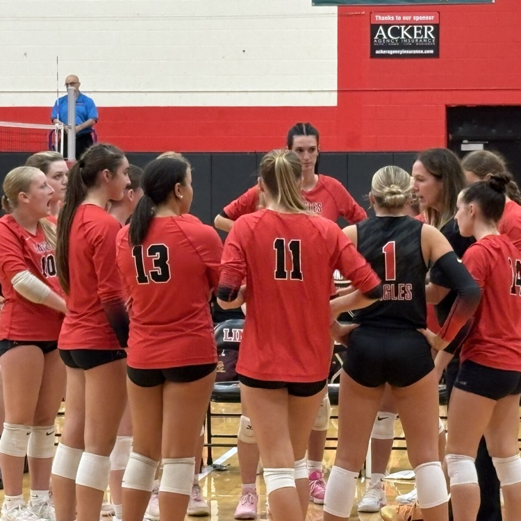 coach and team in a huddle