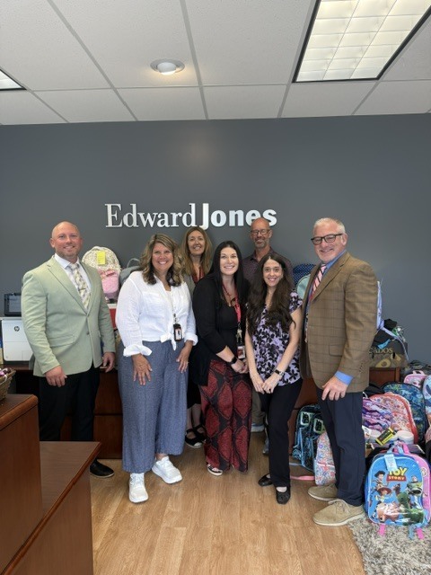 Edward Jones backpack donation with principals from Linden Community Schools