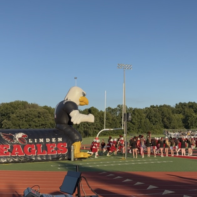football team running onto the field
