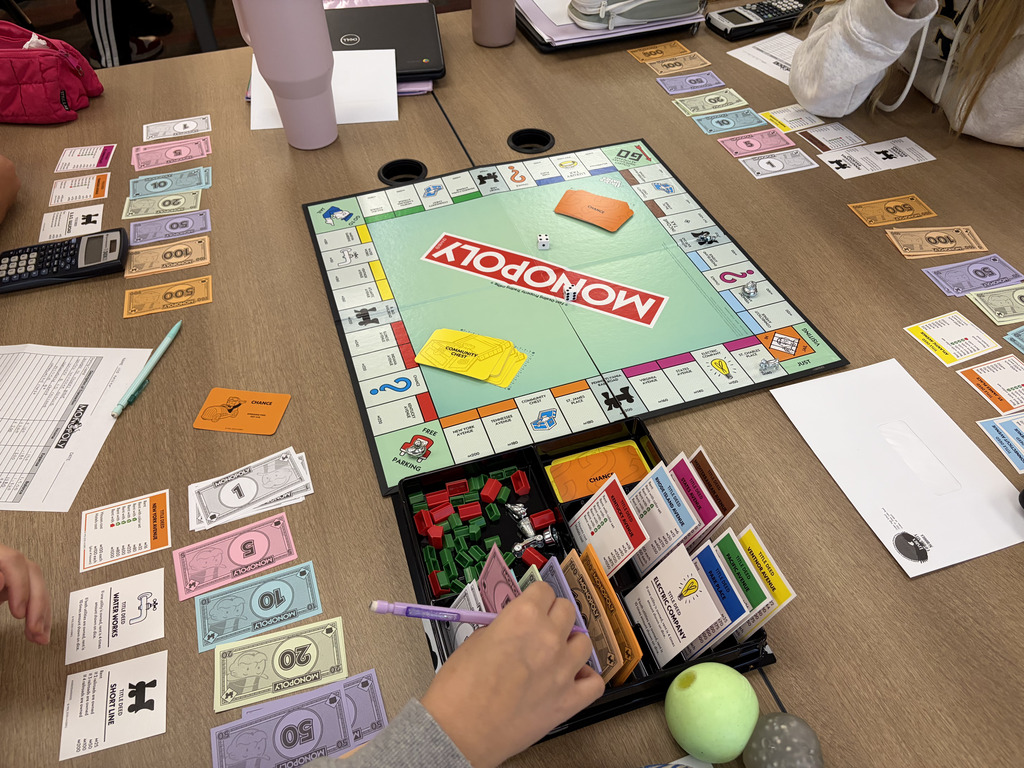 Students in Mrs. Parkin's Accounting I class played Monopoly to practice analyzing transactions and properly identify income and expenses.