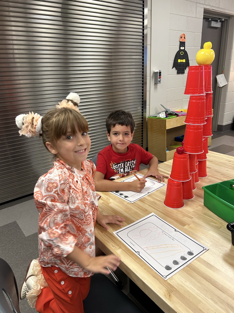 Students working together to build a tower.