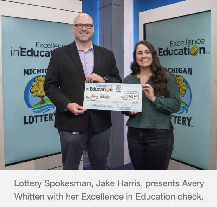 LHS teacher, Avery Whitten, receiving Excellence in Education check from Michigan Lottery