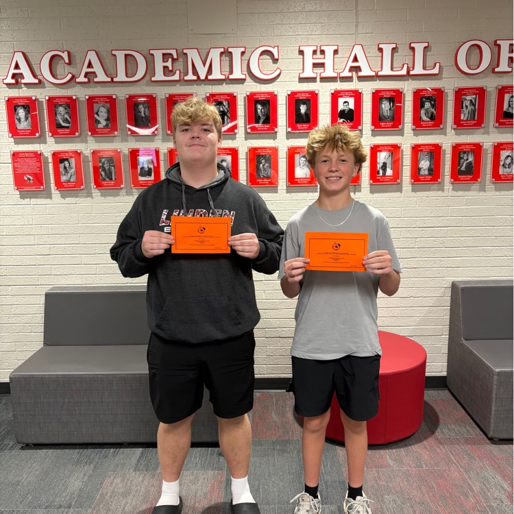 students holding up there honor awards