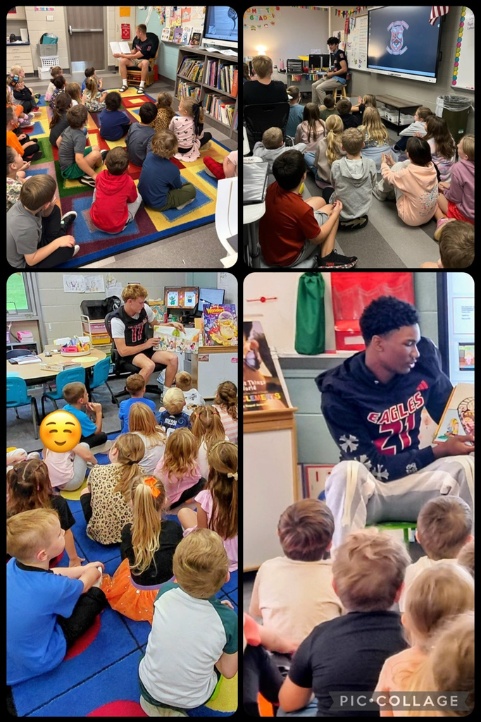 Players reading to students.