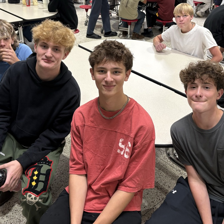 students at lunch after cleaning their table