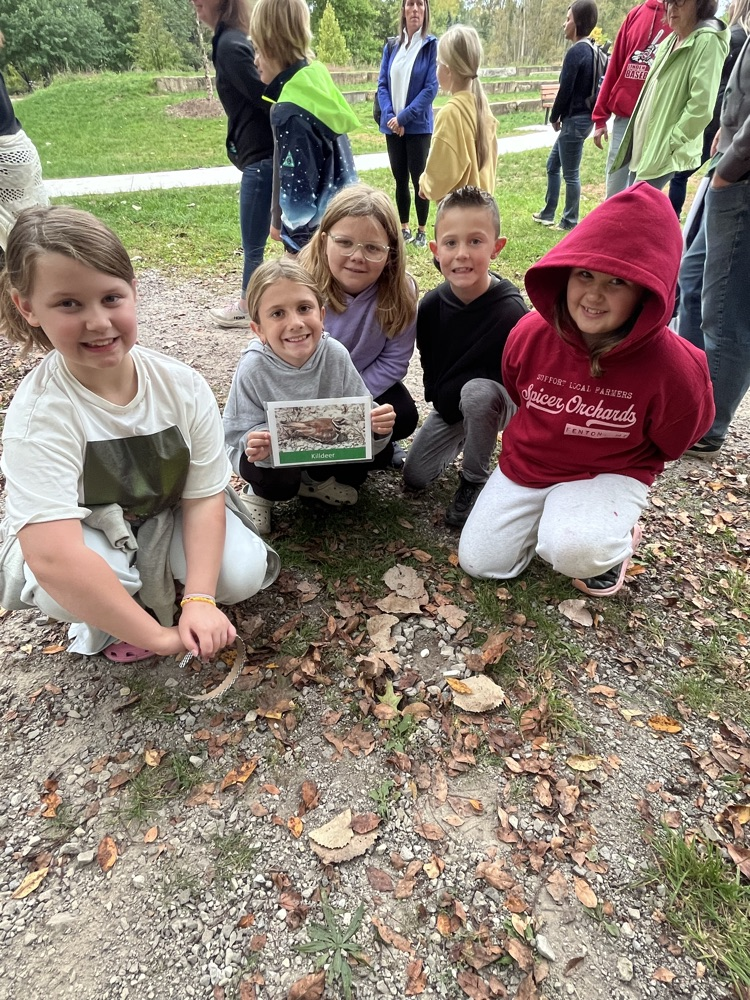 students showing nest they made