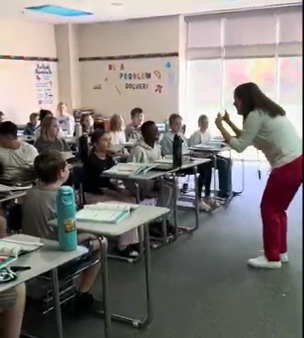 Mrs. Casper has her students' attention as she uses a demand fade technique that includes clapping, snapping, and then focusing.