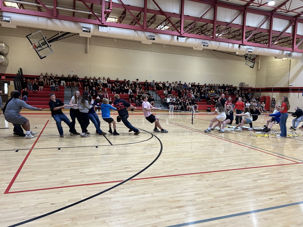 Students participate in a tug of war game