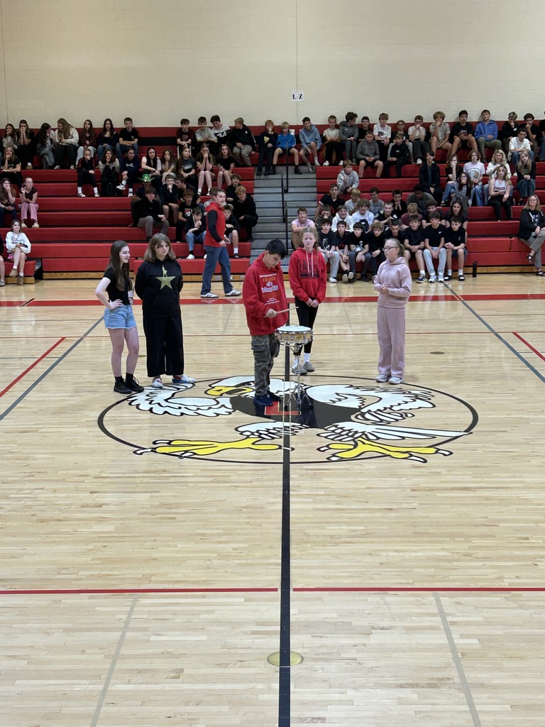 Students compete against each other to see who can hit the drum right when Whitney Houston starts singing