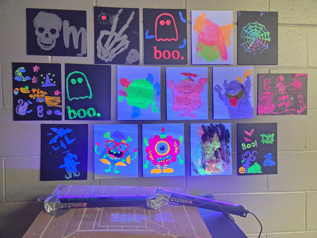 Mrs. Croff’s students’ art work, glowing in the dark.