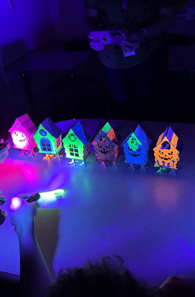 Spooky house projects, all lit up, and glowing in the dark.