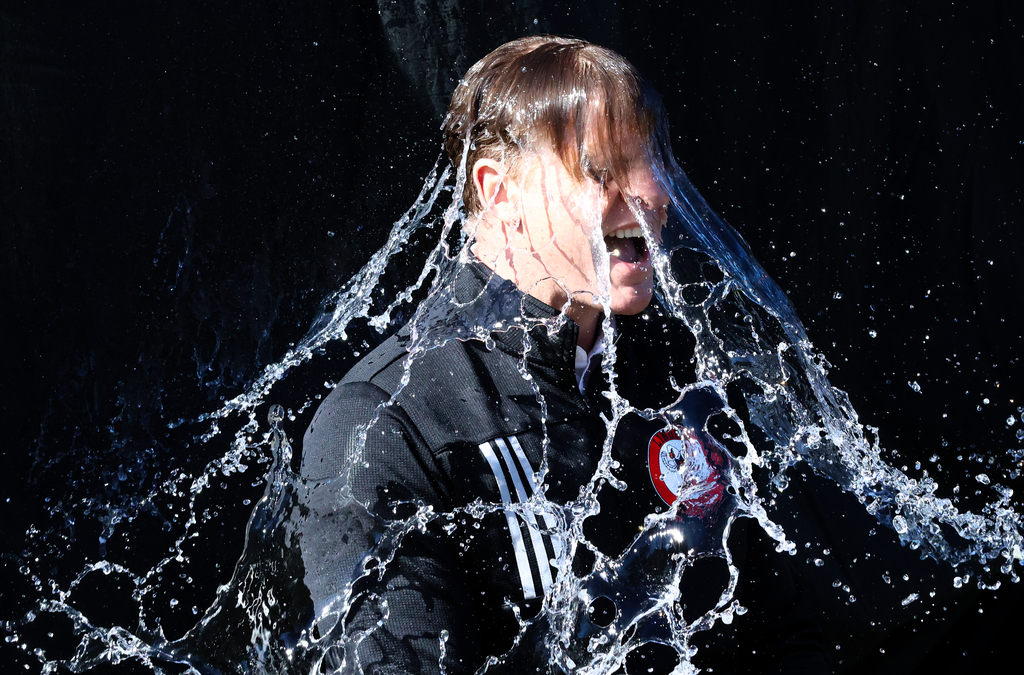 Person with water cascading over them
