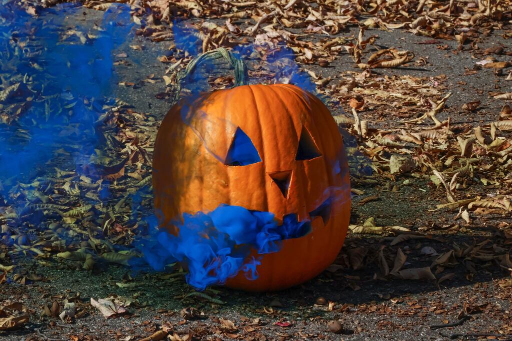 Orange pumpkin with blue smoke