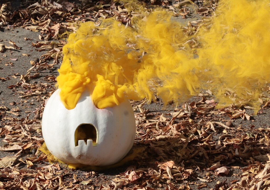 white pumpkin with yellow smoke