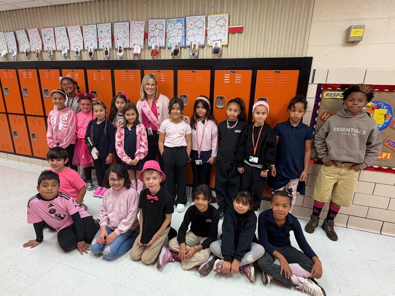 school 10 survivor teacher with students