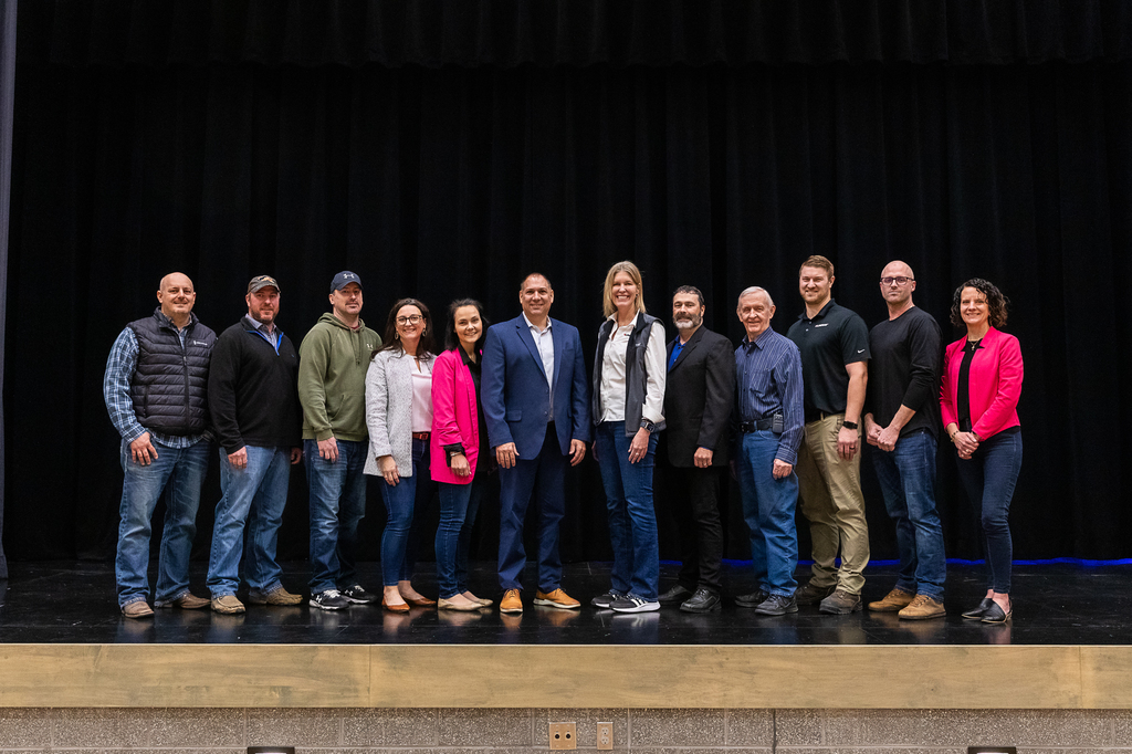 Lindsay Area Development board members take a photo with representatives from Lindsay Corporation during Lindsay Event Center ribbon cutting event.