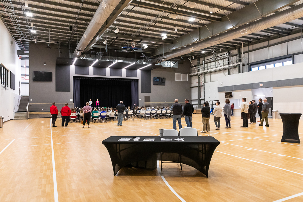 Guests listen to ribbon cutting presentation at the Lindsay Event Center.