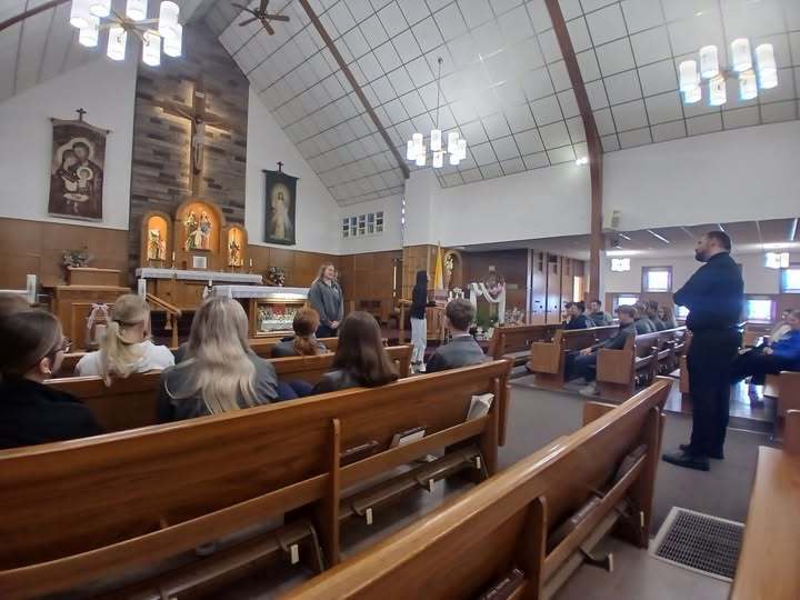 Father Taylor talking to the students