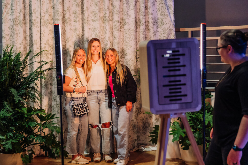 Guest enjoy photobooth at The Grand Reveal.