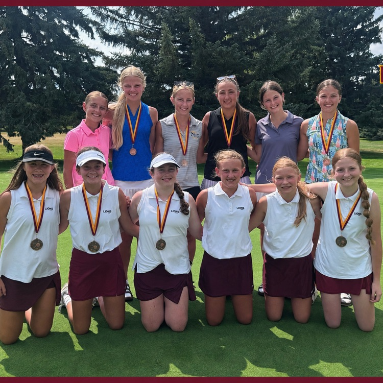 lady lions golf team with medals varsity and jv