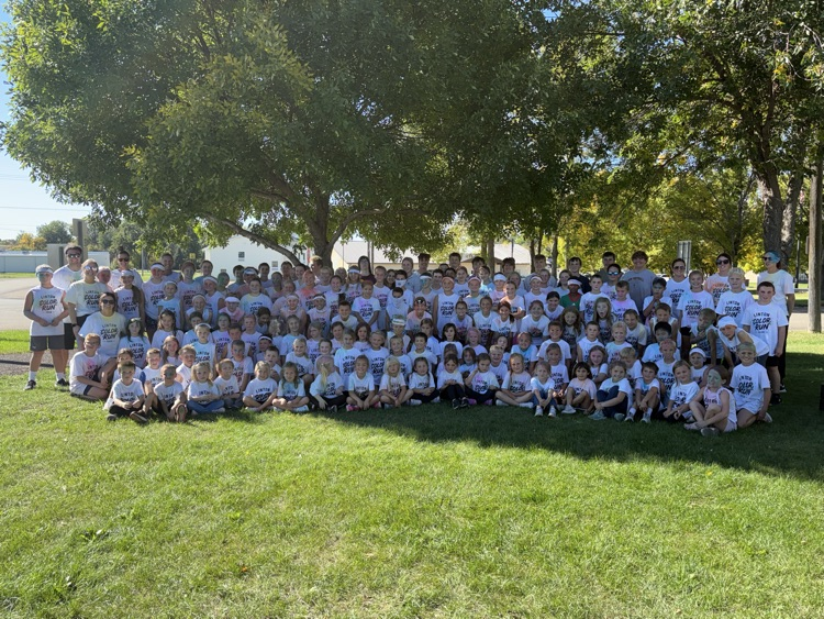 group of students or teachers in front of trees