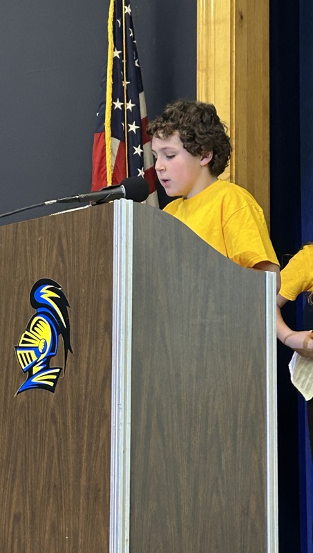 Student presenting at a podium