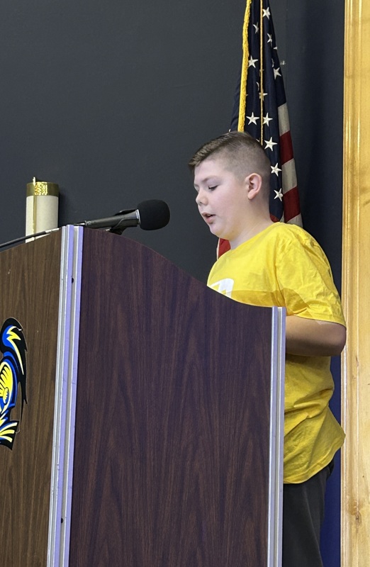 Student presenting at a podium