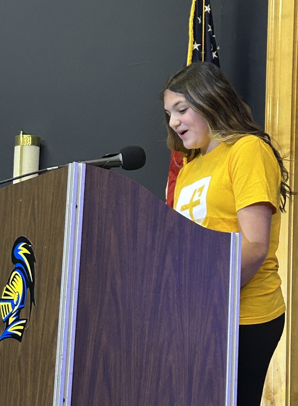 Student presenting at a podium