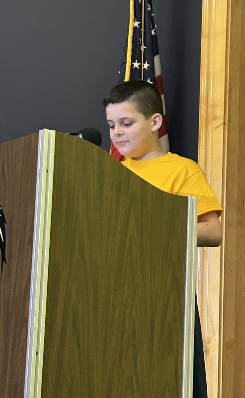 Student presenting at a podium