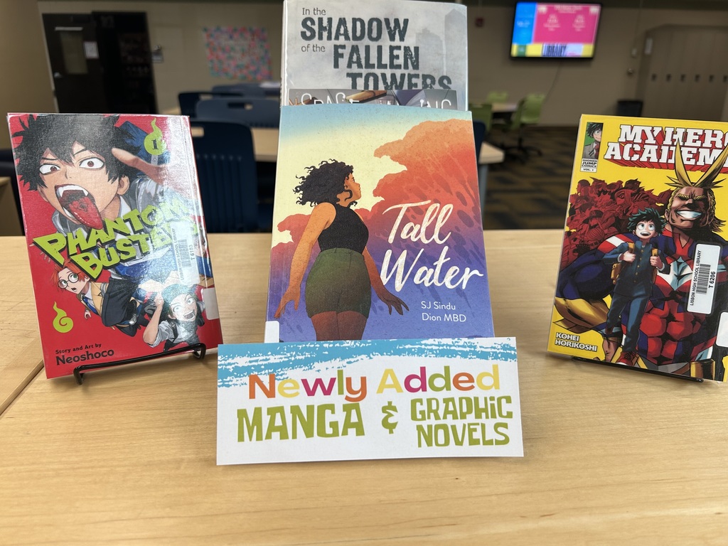 Newly Added Manga & Graphic Novels on a book shelf