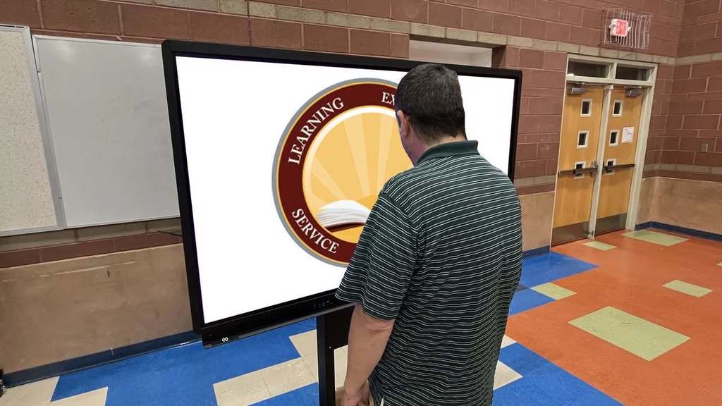 IT member looking at monitor