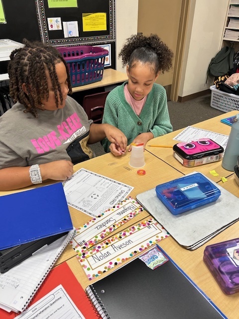 Fifth Grade Students working to Save Fred the gummy worm.