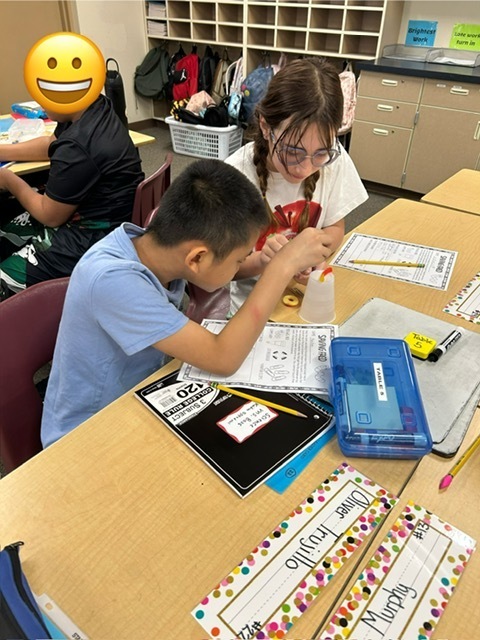 Fifth Grade Students working to Save Fred the gummy worm.