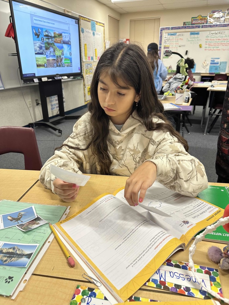 Students in classroom working on Science