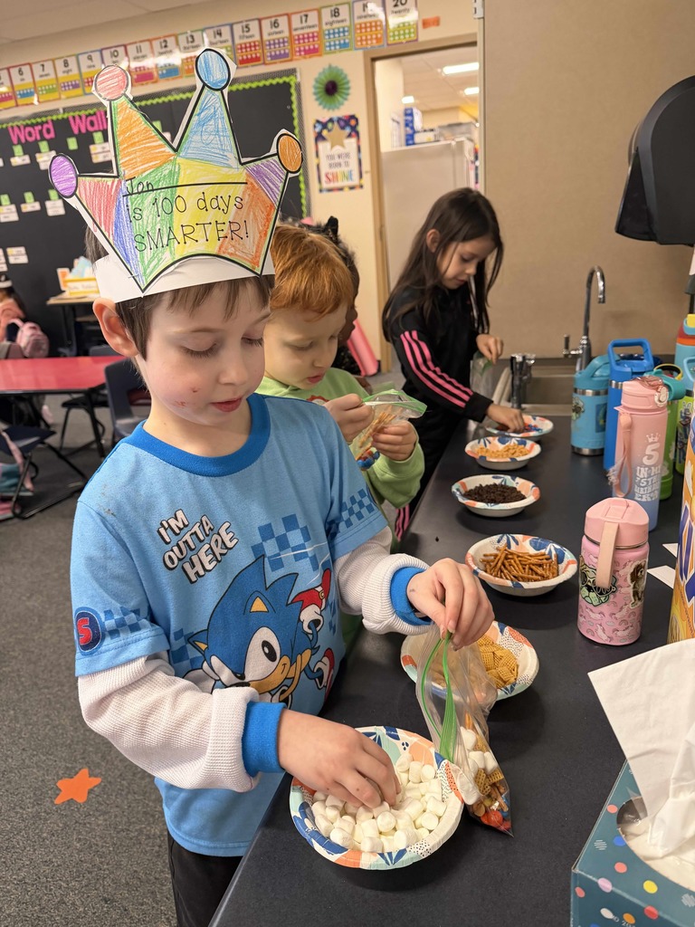 Students making 100th day snack
