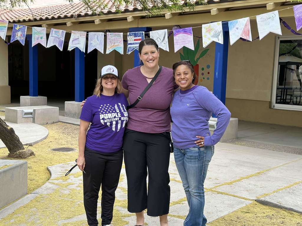 Principal Hill and Admin team wearing purple