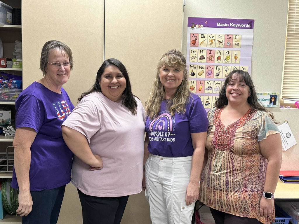 Second grade wearing purple