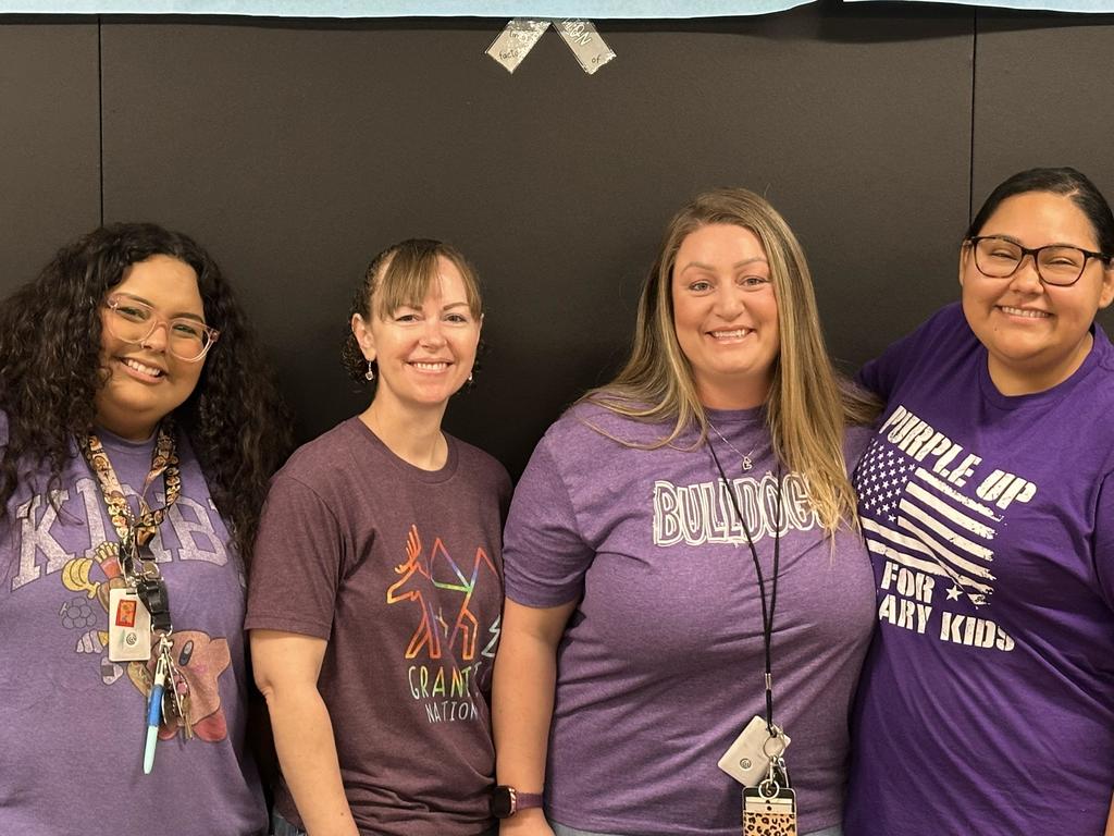 Math assistants wearing purple