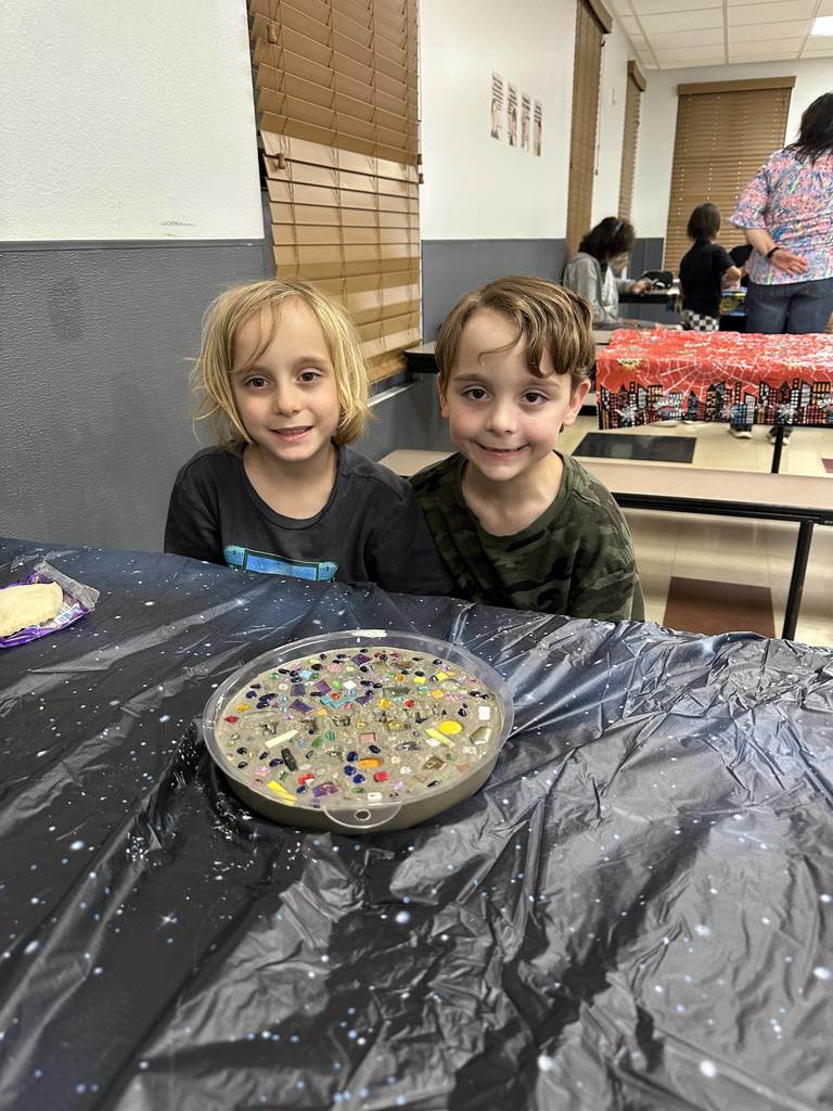 Student creating mosaic tiles
