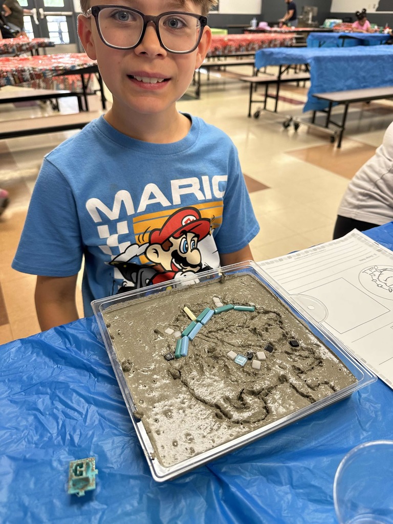Student creating mosaic tiles