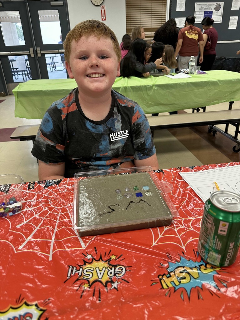 Student creating mosaic tiles