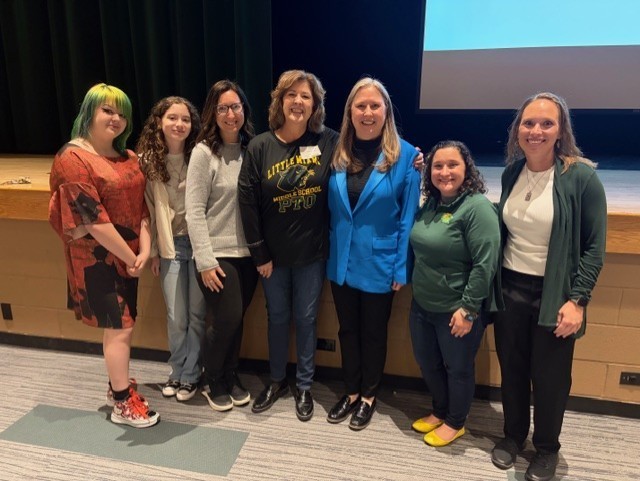 Dr. Erin McGlothlin  with students/staff