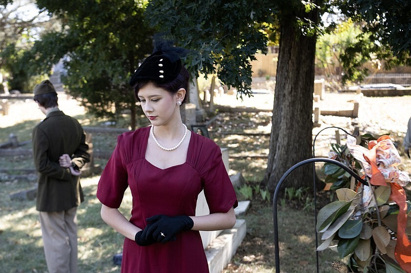 Lorelai Carswell (foreground) and Eli Vanberg, both 17, portray Bertha Coyle Forbes Heiskell and her husband, Carrick White Heiskell, respectively, during "Tales of the Crypt" at Mount Holly Cemetery in Little Rock on Sunday, Oct. 18, 2026. The annual event features theater students from Parkview Arts & Science Magnet High School portraying people buried in the cemetery. Carrick Heiskell was a pilot with the U.S. Army Air Force who was killed in action during World War II. (Arkansas Democrat-Gazette/Adam Vogler)