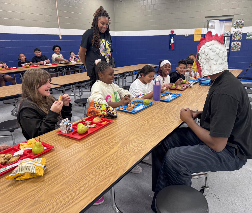"Big Bird" sets with students eating wings