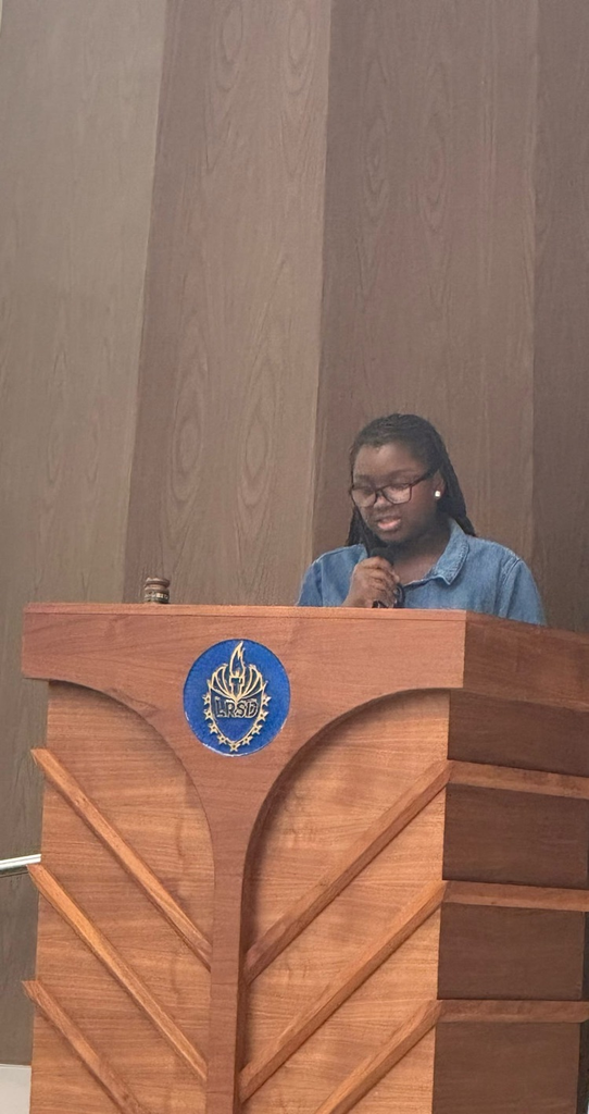 The recorder is going through and giving a speech at the podium
